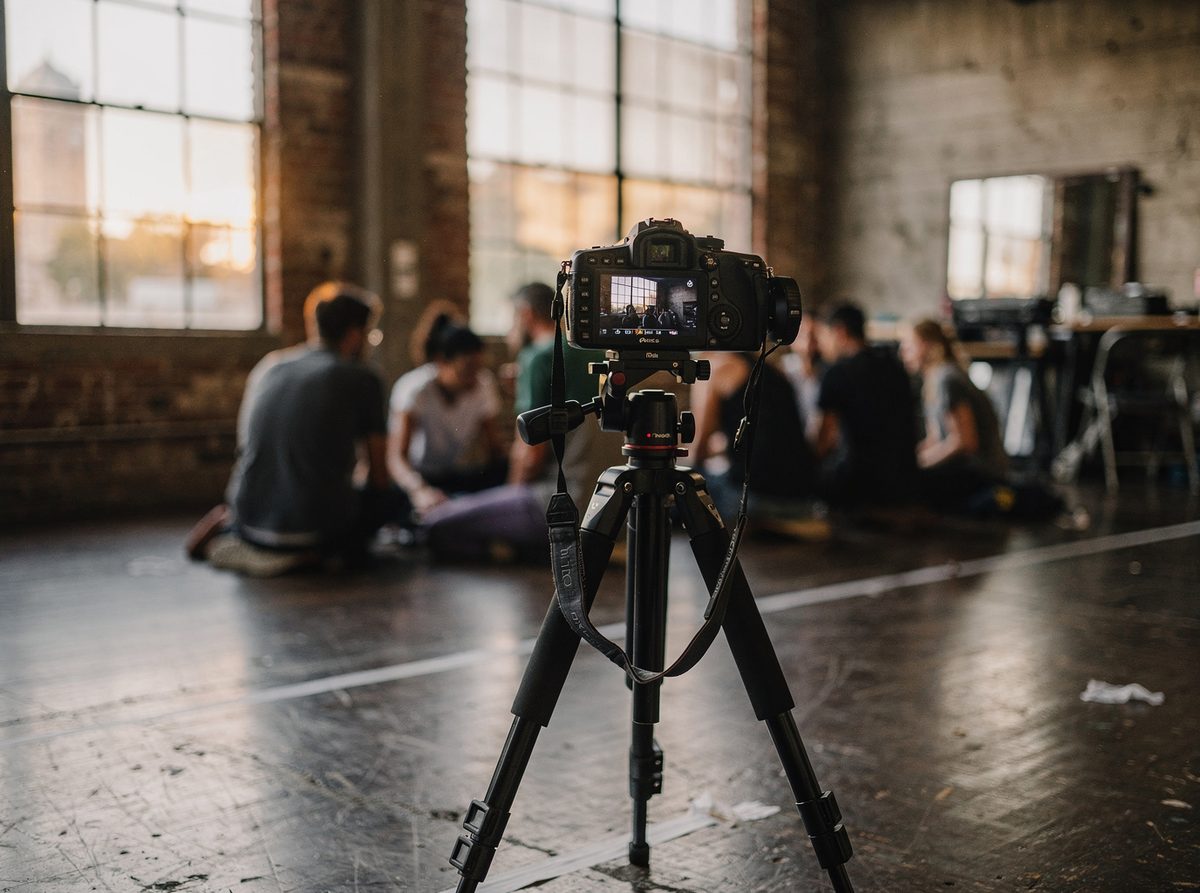 A tripod camera recording a technique class for later review at Totex Movement Studio